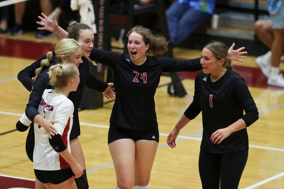 Assumption's Whitney Woodrow (24) tries to keep her teammates motivated as they build a lead against Mercy during their match at the Assumption High School gym in Louisville, Ky. on Sept., 2022.  Assumption won 3-1.