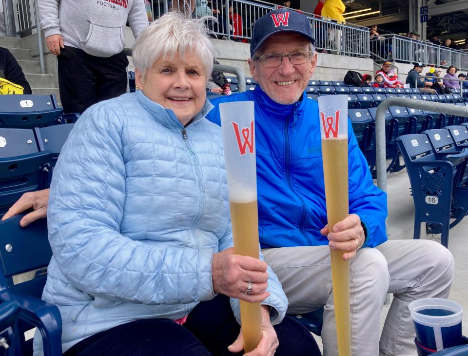 Hudson's Linda Horton and Dave Sheehan enjoy a refreshment during a WooSox game at Polar Park.