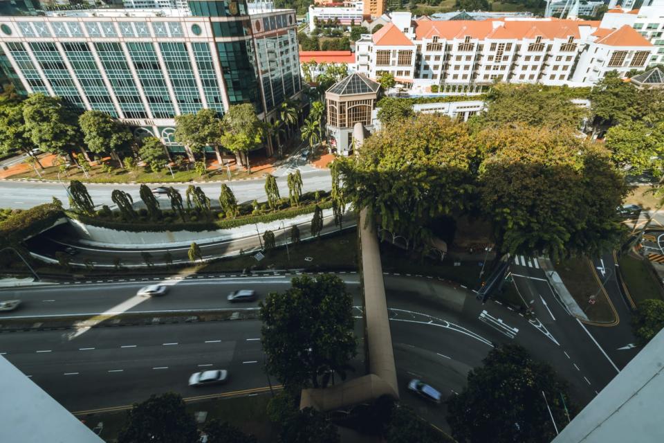 Expressway in Singapore with houses and offices in the background