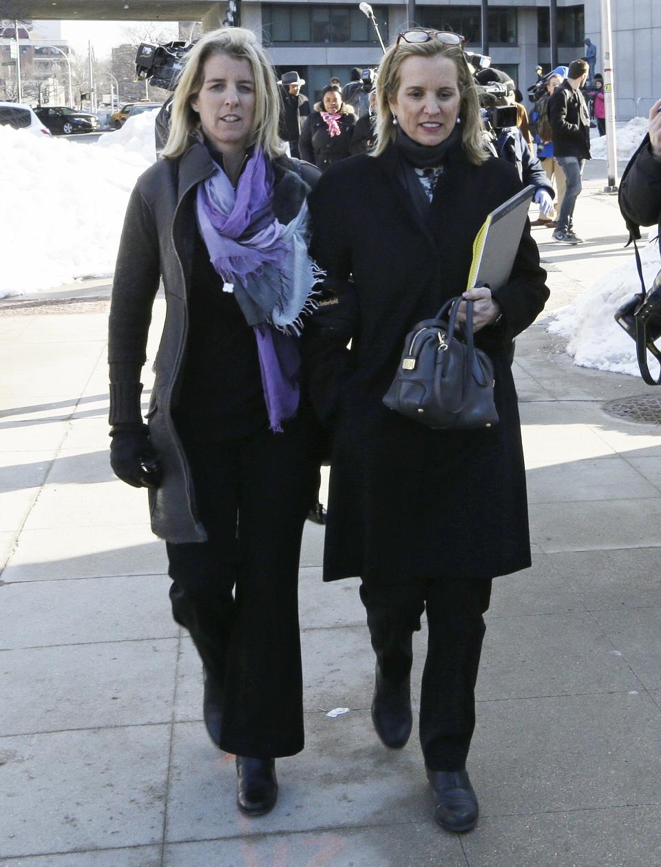 Kerry Kennedy, center, leaves Westchester County courthouse with Rory Kennedy, left, Wednesday, Feb. 26, 2014, in White Plains, N.Y. Kennedy testified at her drugged-driving trial Wednesday that she has no memory of swerving and hitting a tractor-trailer on a suburban New York highway and did not realize she was impaired when she got behind the wheel. (AP Photo/Frank Franklin II)