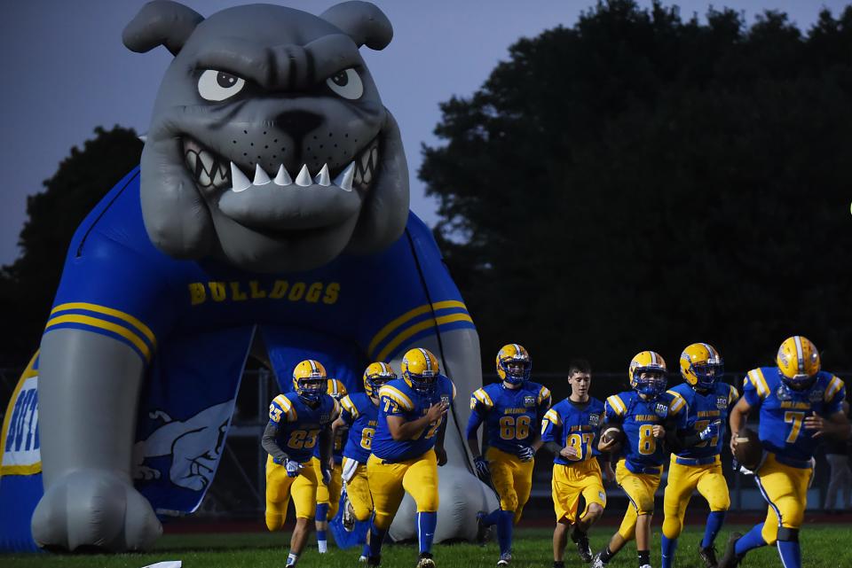 Butler runs onto the field prior to the football game between Butler and Hasbrouck Heights in Butler on Friday September 28, 2018.