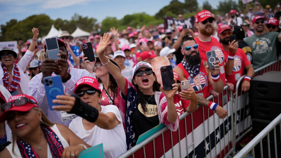 Attendees cheer at Trump's campaign rally on June 9, 2024, in Las Vegas. - John Locher/AP
