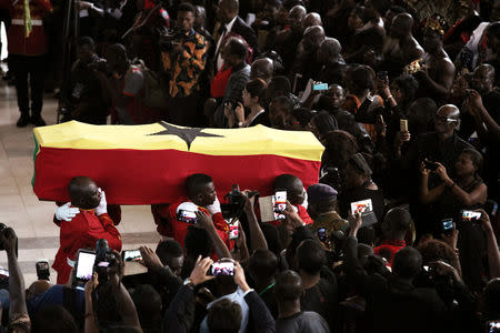 Honour guards carry a flag-draped casket of the former United Nations Secretary General Kofi Annan, who died in Switzerland, during the funeral service at the international Conference Centre in Accra, Ghana September 13, 2018. REUTERS/Francis Kokoroko