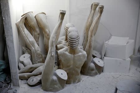 Parts of fiberglass mannequins are seen covered with dust at a workshop in El Kharqanya village, El-Kalubia governorate, north of Cairo, Egypt, March 23, 2017. REUTERS/Amr Abdallah Dalsh