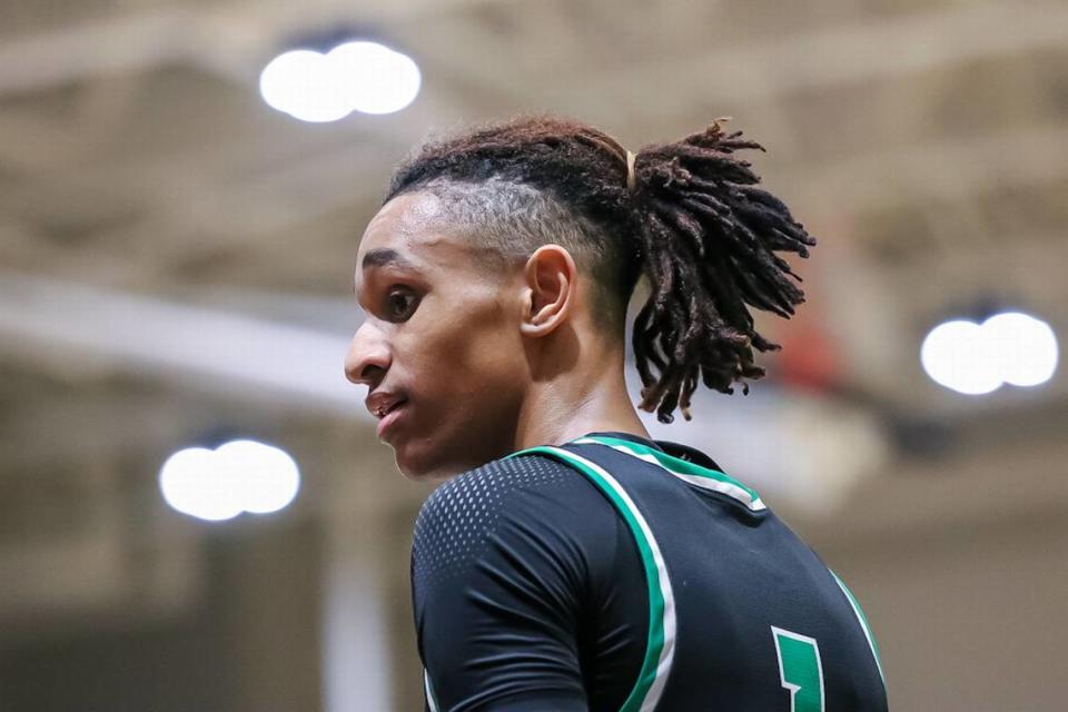 Myers Park’s Sadiq White catches a quick breather during a break in the action