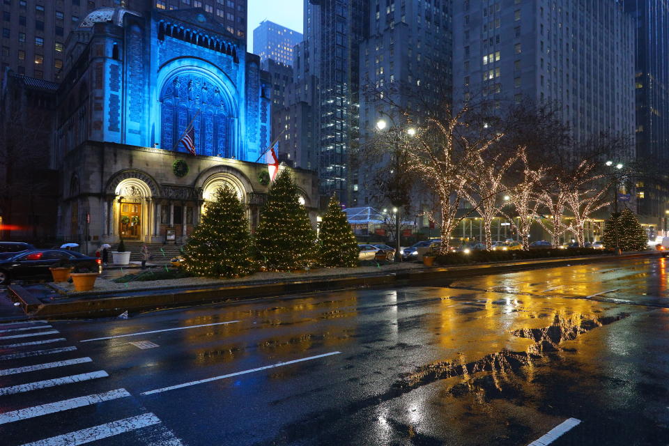 Christmas lights reflect off a rain-slicked Park Avenue outside St. Bartholomew’s Church in midtown Manhattan. The church is a popular destination for visitors during the holiday season. (Photo: Gordon Donovan/Yahoo News)