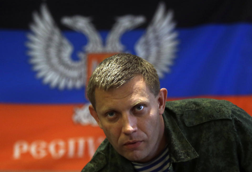 FILE - In this Sunday, Aug. 24, 2014 file photo, Alexander Zakharchenko, Prime Minister of the self-declared Donetsk People's Republic, is seen in Donetsk, Ukraine. The leader of the Russia-backed separatists fighting in eastern Ukraine's Donetsk region was killed Friday, Aug. 31, 2018 by an explosion at a cafe, the separatists' news agency said Friday. Rebel news agency DAN said the afternoon explosion killed Alexander Zakharchenko, 42, the prime minister of the self-declared Donetsk People's Republic. (AP Photo/Sergei Grits, file)