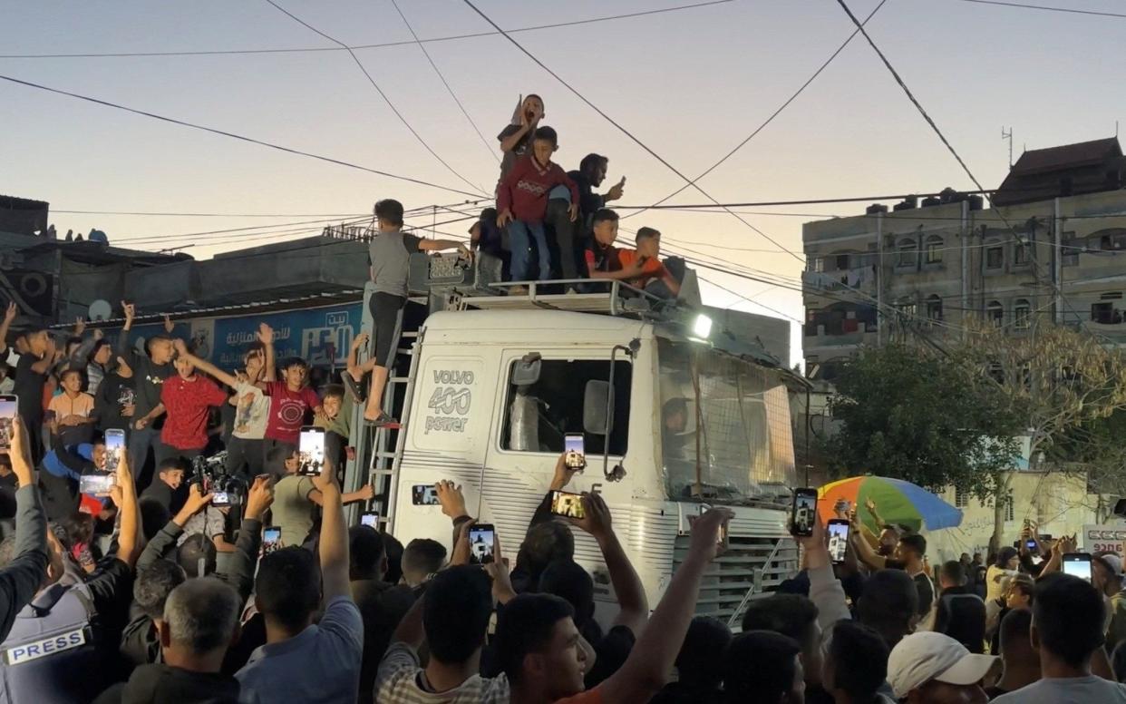 Palestinians in Rafah celebrate news that Hamas had accepted an Egyptian-Qatari ceasefire deal