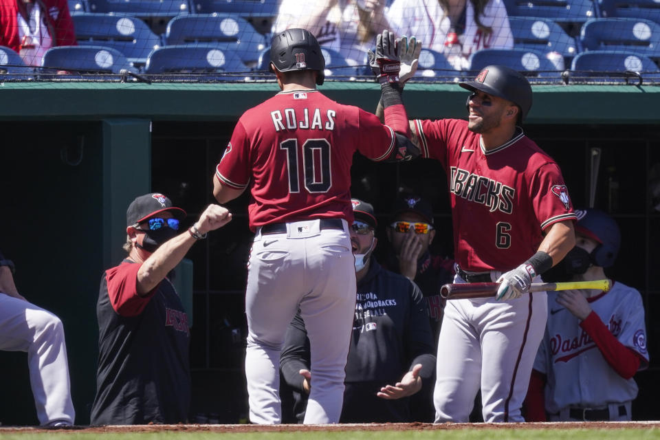 Arizona Diamondbacks' Josh Rojas celebrates his solo home run during the first inning of a baseball game against the Washington Nationals at Nationals Park, Sunday, April 18, 2021, in Washington. (AP Photo/Alex Brandon)