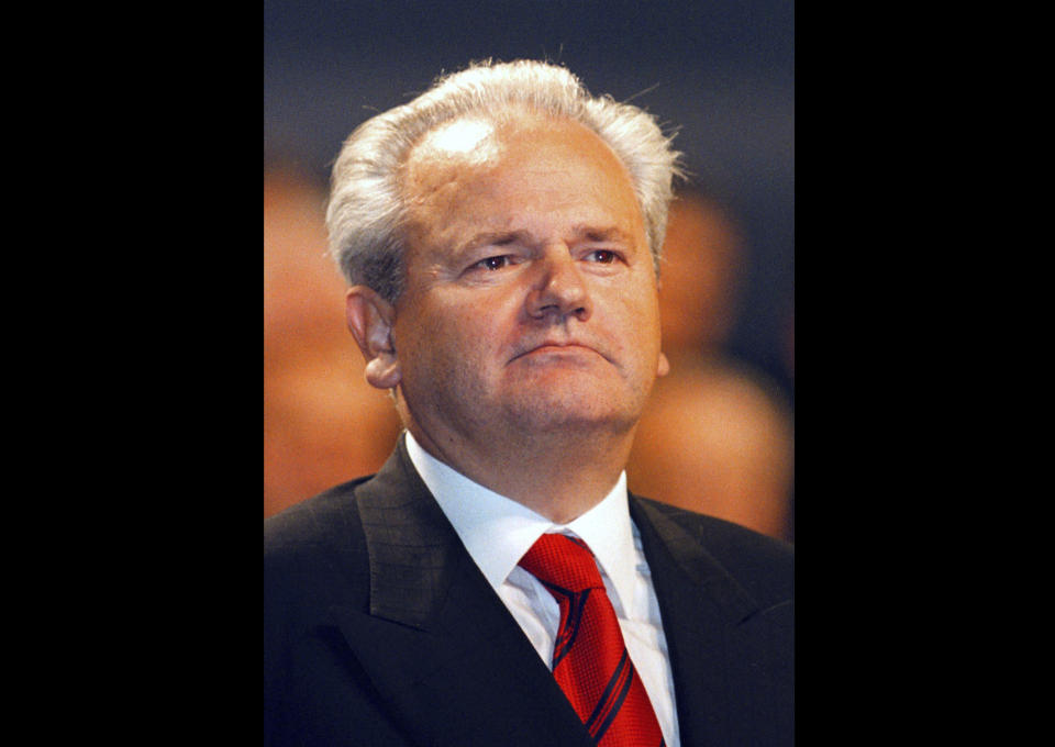 FILE - In this 1997 file photo, former Yugoslavia's President Slobodan Milosevic looks his supporters, in Belgrade, Serbia. Serbian President Aleksandar Vucic said in his keynote speech while visiting Kosovo's Serbs on Sunday Sept. 9, 2018, that former Serbian president Milosevic "was a great Serbian leader" whose "aims were certainly the best." (AP Photo/Darko Vojinovic, File)