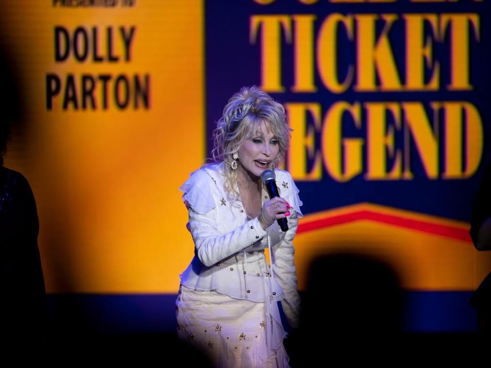 Dolly Parton performs her hit song "9 to 5" at the Golden Ticket Awards at Dollywood on Sept. 9.