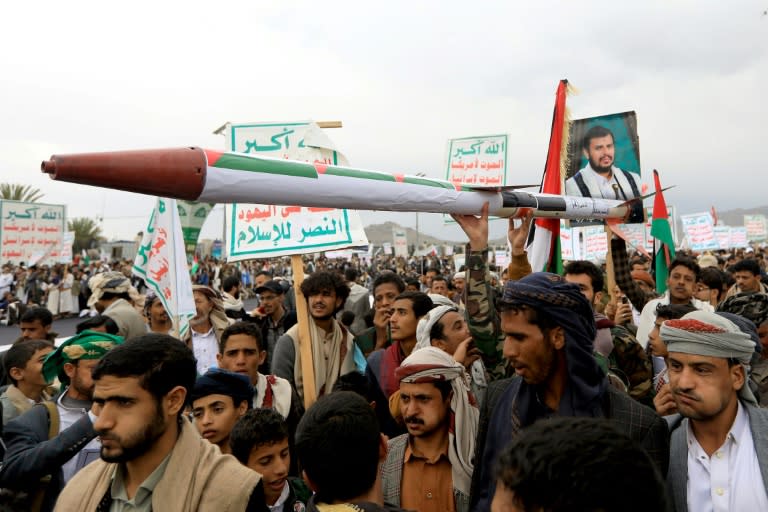 Demonstrators carry a mock missile during a pro-Palestinian and anti-Israel rally in Yemen's Huthi-held capital Sanaa on April 26 (MOHAMMED HUWAIS)