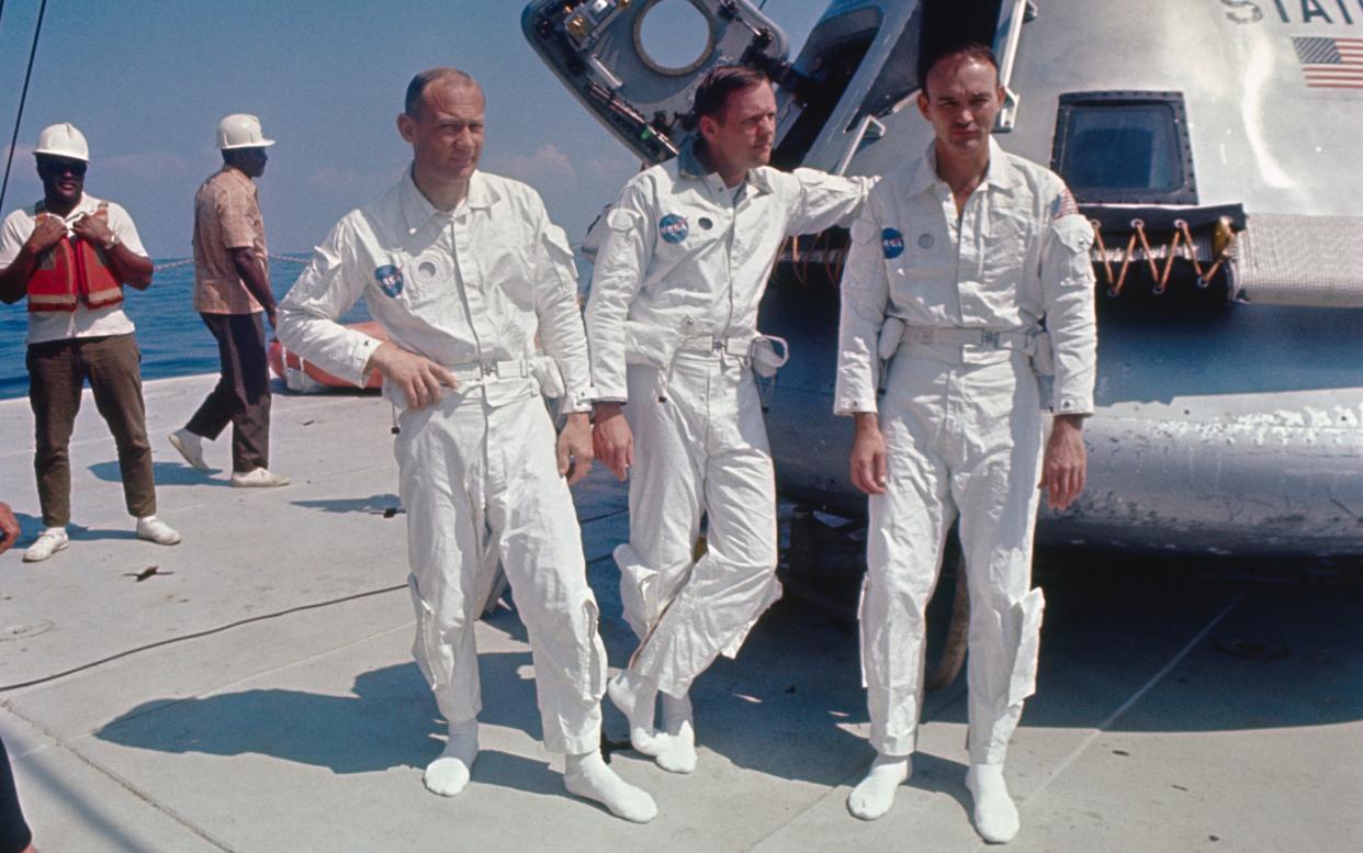 Aldrin, Armstrong and Collins beside an Apollo training capsule, 1969 - GETTY IMAGES