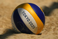 A volleyball rests in the sand during during women's beach volleyball practice at the 2020 Summer Olympics, Monday, July 19, 2021, in Tokyo. (AP Photo/Charlie Riedel)