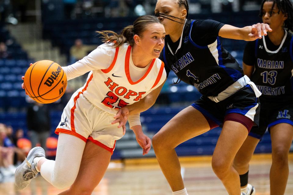 Hope's Olivia Bellows drives past her defender Thursday, Nov. 9, 2023, at DeVos Fieldhouse.