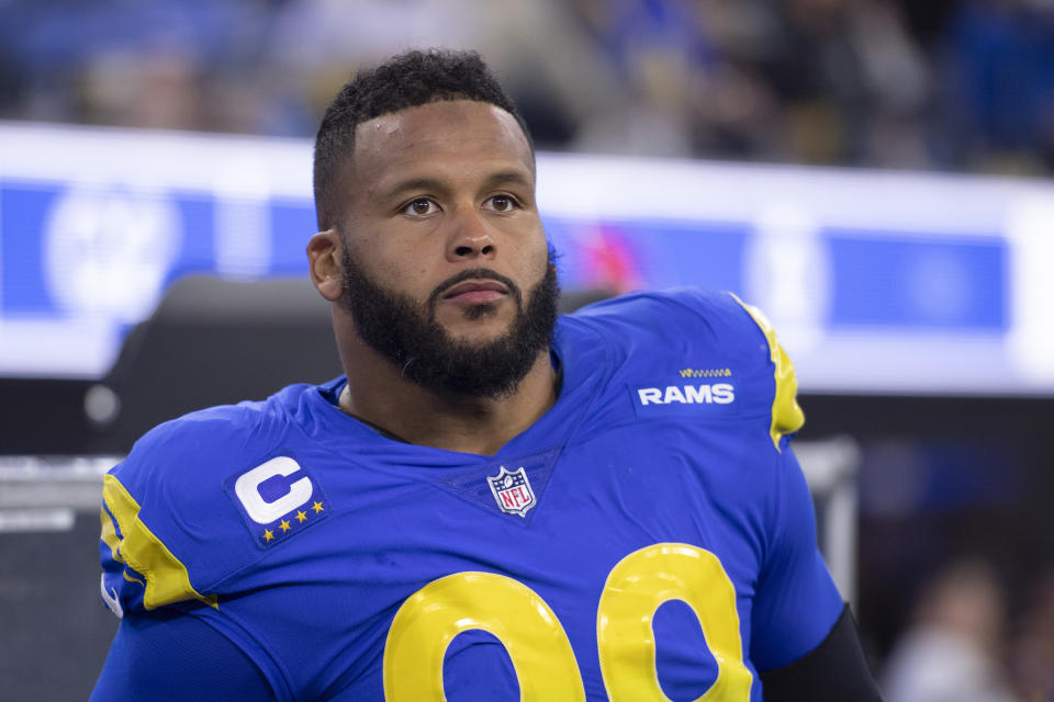 Los Angeles Rams defensive end Aaron Donald (99) watches his team during an NFL wild-card playoff football game against the Arizona Cardinals Monday, Jan. 17, 2022, in Inglewood, Calif. (AP Photo/Kyusung Gong)