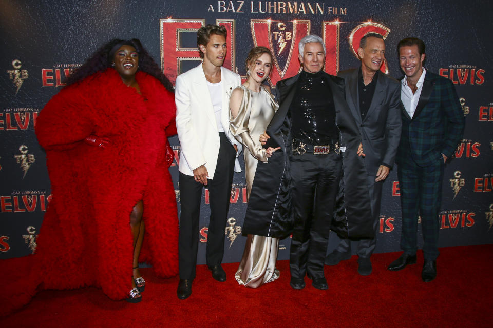 Yola, from left, Austin Butler, Olivia Dejonge, director Baz Luhrmann, Tom Hanks and Luke Bracey pose for photographers upon arrival for the premiere of the film 'Elvis' in London Tuesday, May 31, 2022. (Photo by Joel C Ryan/Invision/AP)