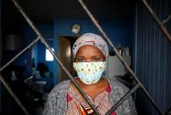 Domestic worker Alphonia Zali looks out from her two roomed apartment in Langa township near Cape Town