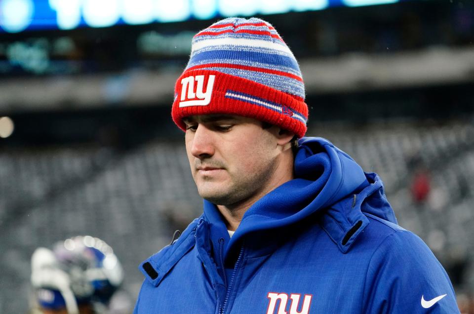 New York Giants quarterback Daniel Jones walks off the field after the Giants fall to the Washington Football Team, 22-7, at MetLife Stadium on Sunday, Jan. 9, 2022.