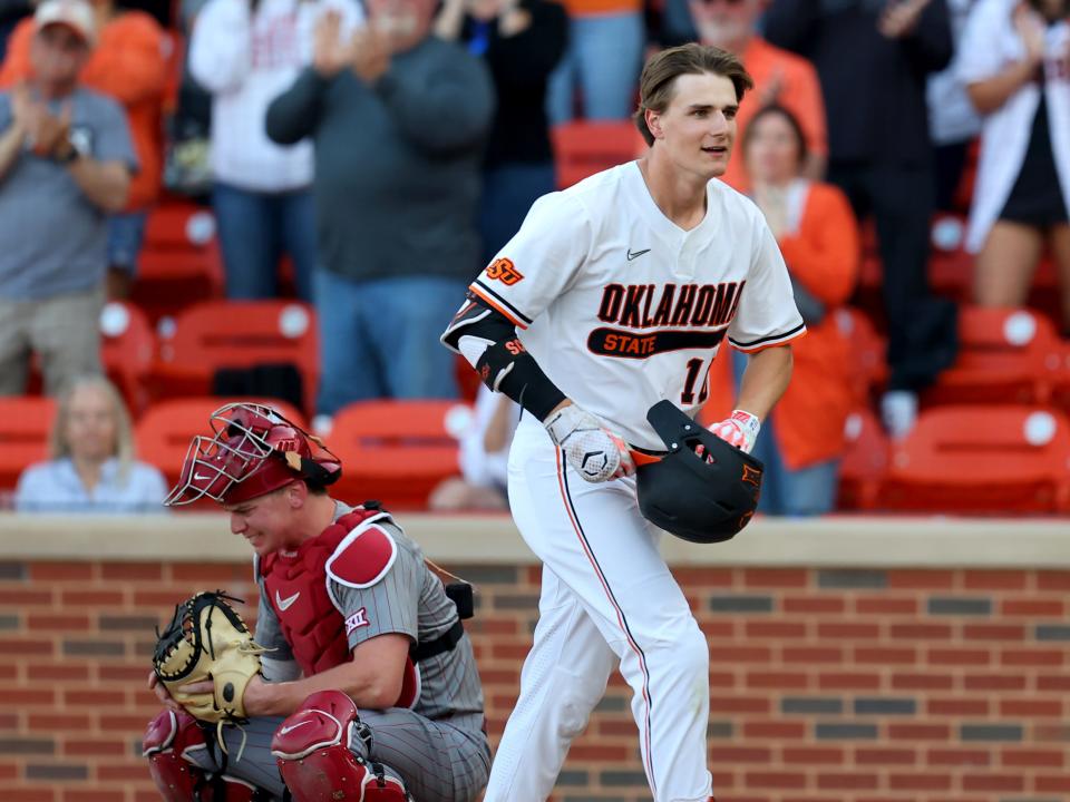 Oklahoma State's Nolan Schubart (10) reacts after a home run next Oklahoma's Scott Mudler (22) in the first inning during the college Bedlam baseball game between Oklahoma State University Cowboys and the University of Oklahoma Sooners at O'Brate Stadium in Stillwater, Okla., Friday, April 5, 2024.