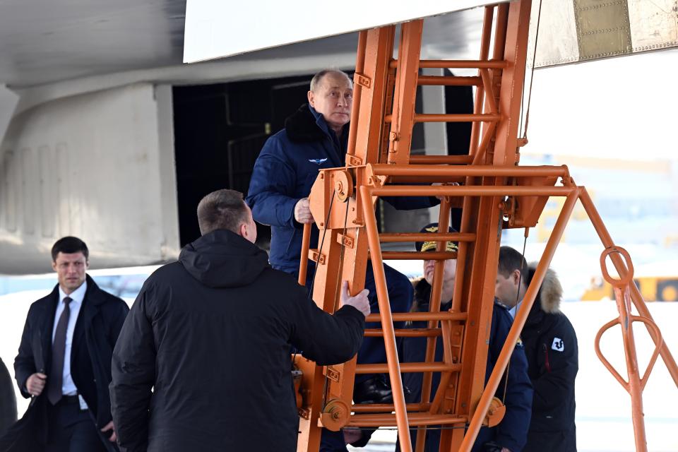 Russian President Vladimir Putin, top, boards a Tu-160M strategic bomber in Kazan, Russia, Thursday, Feb. 22, 2024. (Dmitry Azarov, Sputnik, Kremlin Pool Photo via AP)