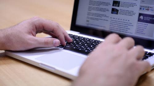 A man uses a laptop computer in Brisbane Monday, Sept. 16, 2013. (AAP Image/Dan Peled)