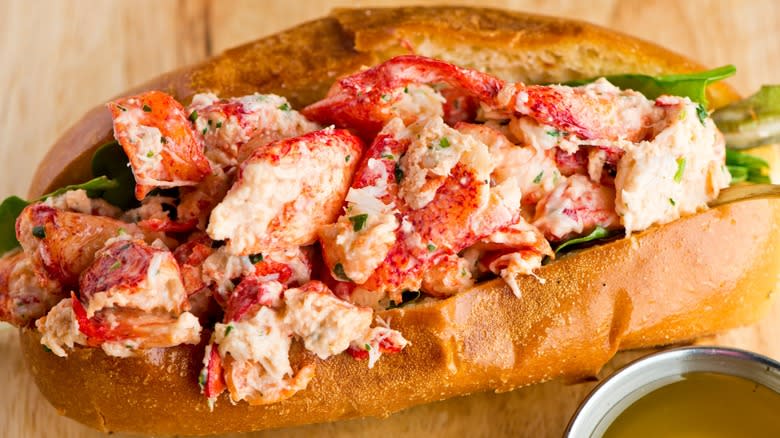 Close-up of a lobster roll plated with butter