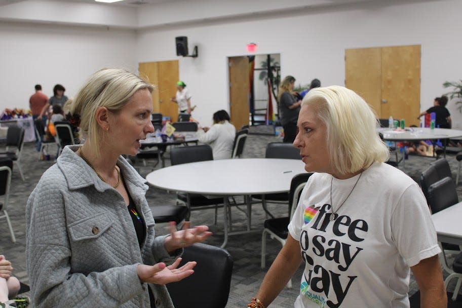 A Niceville Pride Event attendee is seen talking to Democratic challenger to Florida Rep. Matt Gaetz, Gay Valimont