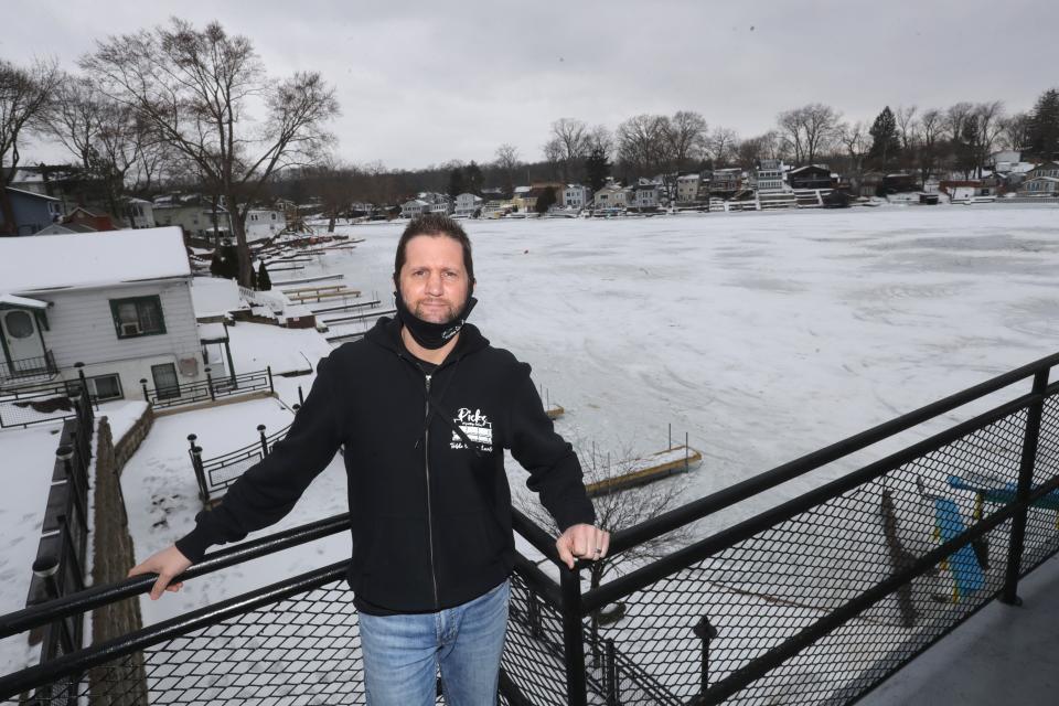 Donnie Boyer, owner of Pick's at Portage Lakes, stands on the restaurant deck overlooking the scene of a fatal ATV accident in Coventry Township in February 2021. The restaurant donated 100% of its sales one day to support the Spencer family.