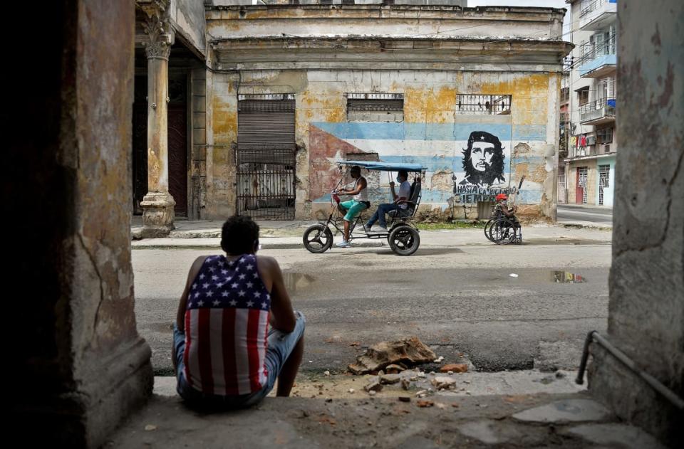 <div class="inline-image__caption"><p>A man sits in Havana, Cuba on Oct. 21, 2020, amid the COVID-19 pandemic.</p></div> <div class="inline-image__credit">Yamil Lage/AFP via Getty Images</div>