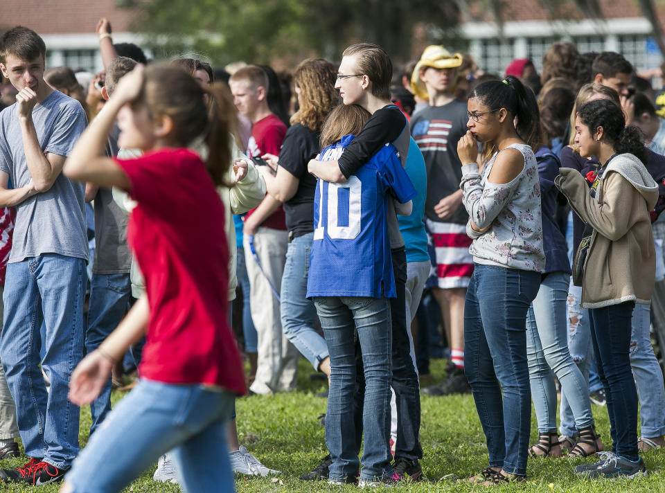 <p>Forest High School students console one another after a school shooting at Forest High School Friday, April 20, 2018 in Ocala, Fla. (Photo: Doug Engle/Star-Banner via AP) </p>