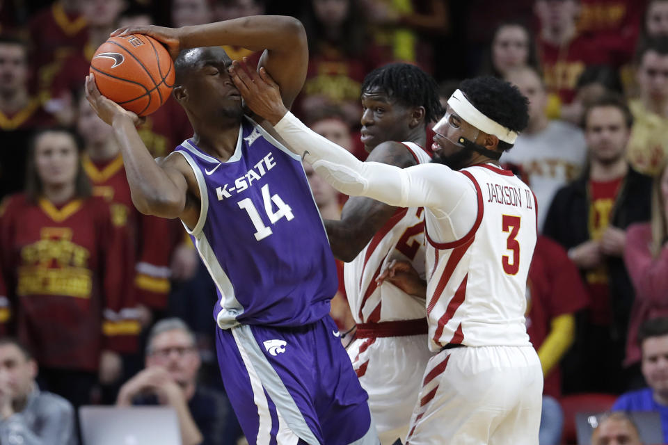 Iowa State guard Tre Jackson, right, defends as Kansas State forward Makol Mawien, left, looks to pass during the second half of an NCAA college basketball game, Saturday, Feb. 8, 2020, in Ames, Iowa. (AP Photo/Matthew Putney)