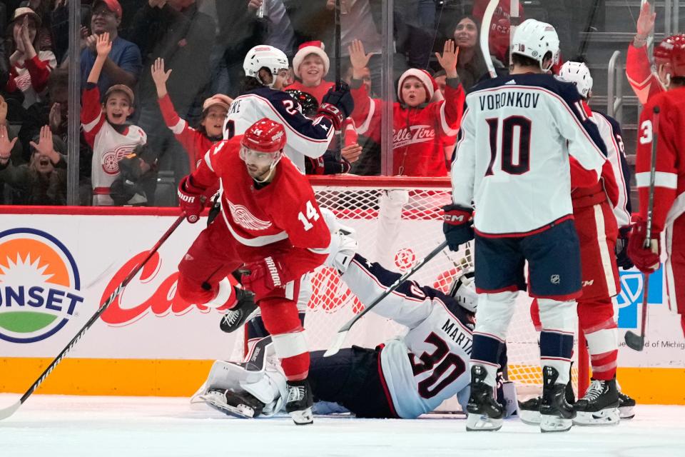 Detroit Red Wings center Robby Fabbri (14) celebrates his goal against the Columbus Blue Jackets in the third period of an NHL hockey game Saturday, Nov. 11, 2023, in Detroit. (AP Photo/Paul Sancya)