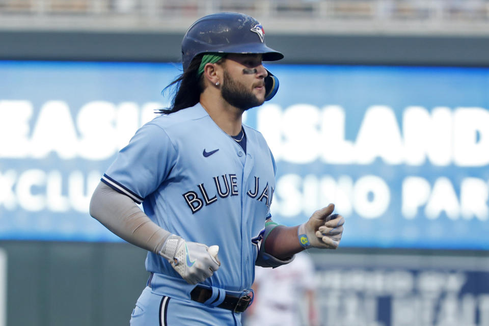 Toronto Blue Jays' Bo Bichette runs the bases on his two-run home run against the Minnesota Twins during the third inning of a baseball game Friday, May 26, 2023, in Minneapolis. (AP Photo/Bruce Kluckhohn)