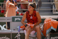 Karolina Muchova of the Czech Republic massages her right leg in the third set of the semifinal match of the French Open tennis tournament against Aryna Sabalenka of Belarus at the Roland Garros stadium in Paris, Thursday, June 8, 2023. (AP Photo/Thibault Camus)