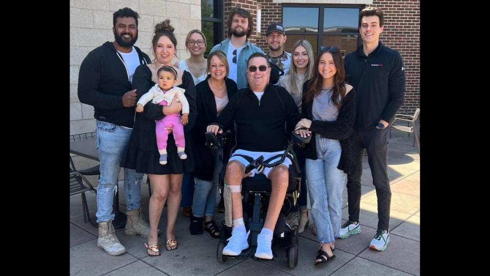 Wichita State baseball Hall of Famer Carl Hall, center, is surrounded by family in this recent photo. He was paralyzed from the neck down after a 2010 car accident. He died March 3.