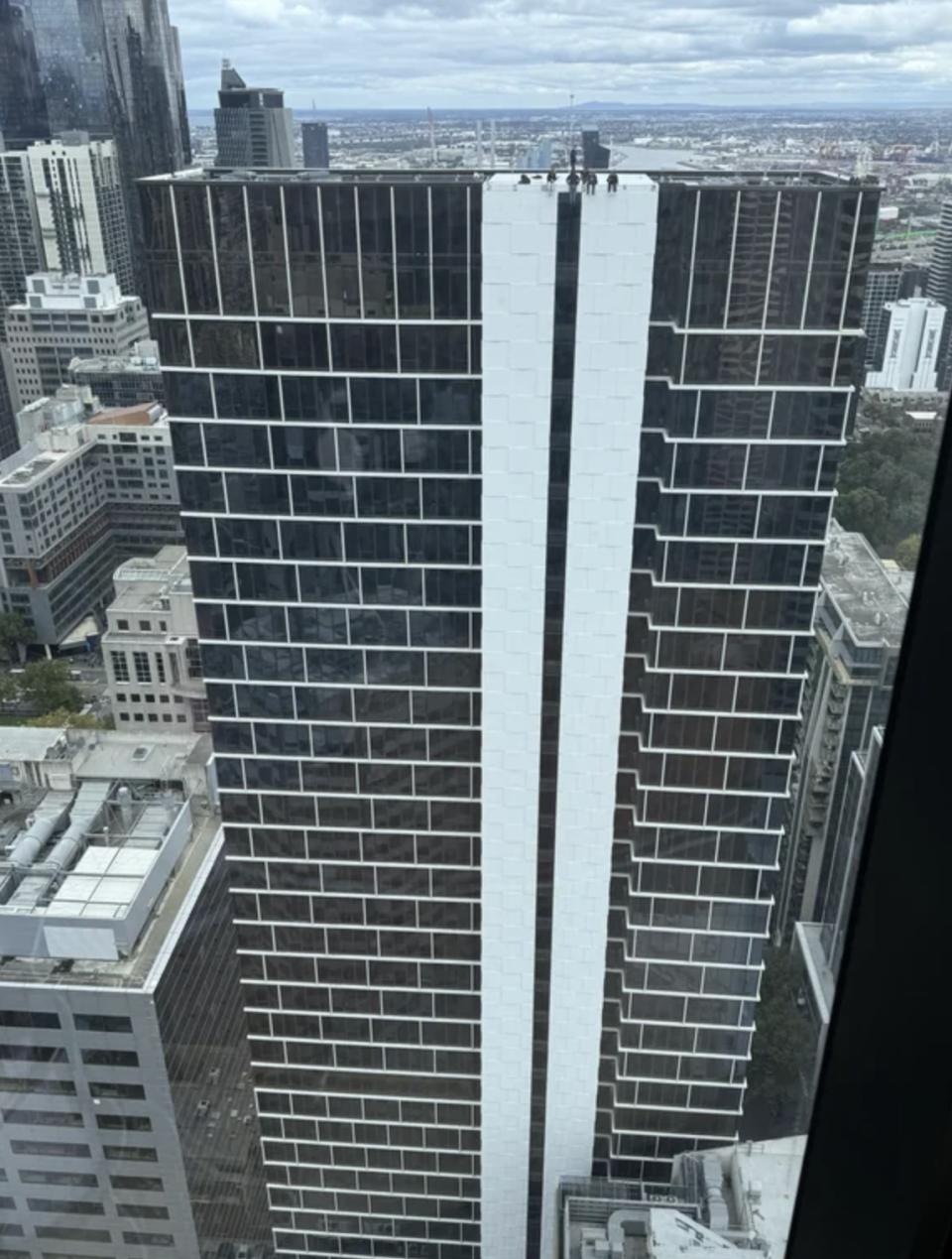 A group sitting atop the Y Suites building in Melbourne. Source: Reddit