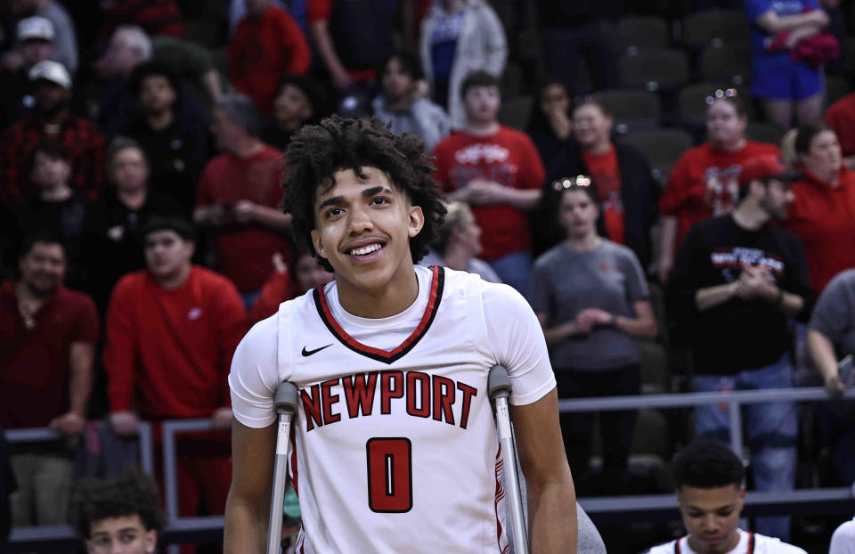 Newport's Taylen Kinney reacts after Newport's Ninth Region championship win over Cooper Tuesday, March 12, 2024. Kinney was injured in the first half.