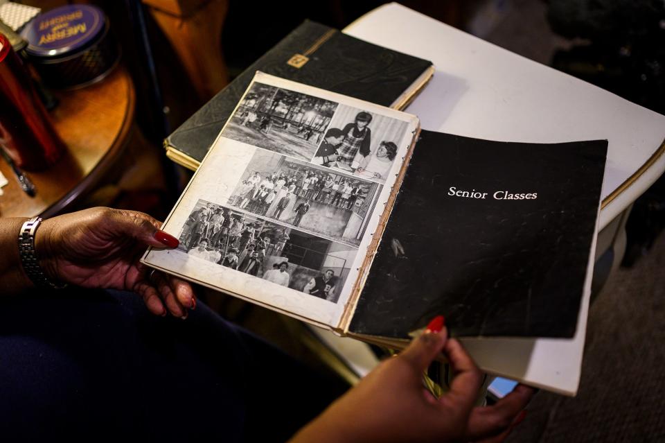 Barbara Franklin looks through a Beck High School yearbook. An abbreviated version of the yearbook was printed in limited quantities for the senior class at Beck, who moved to different schools during the school year.