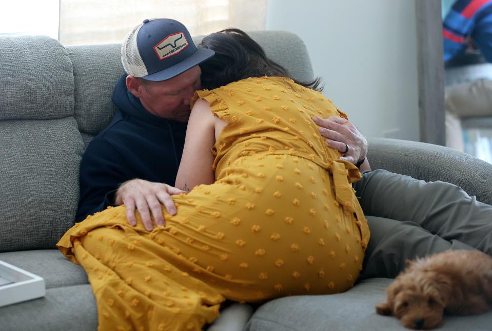 Andrew comforts his wife Lyndsey as she takes a break from an interview about surviving domestic violence in her previous relationship at their home in Santaquin on Tuesday, Oct. 24, 2023. | Kristin Murphy, Deseret News
