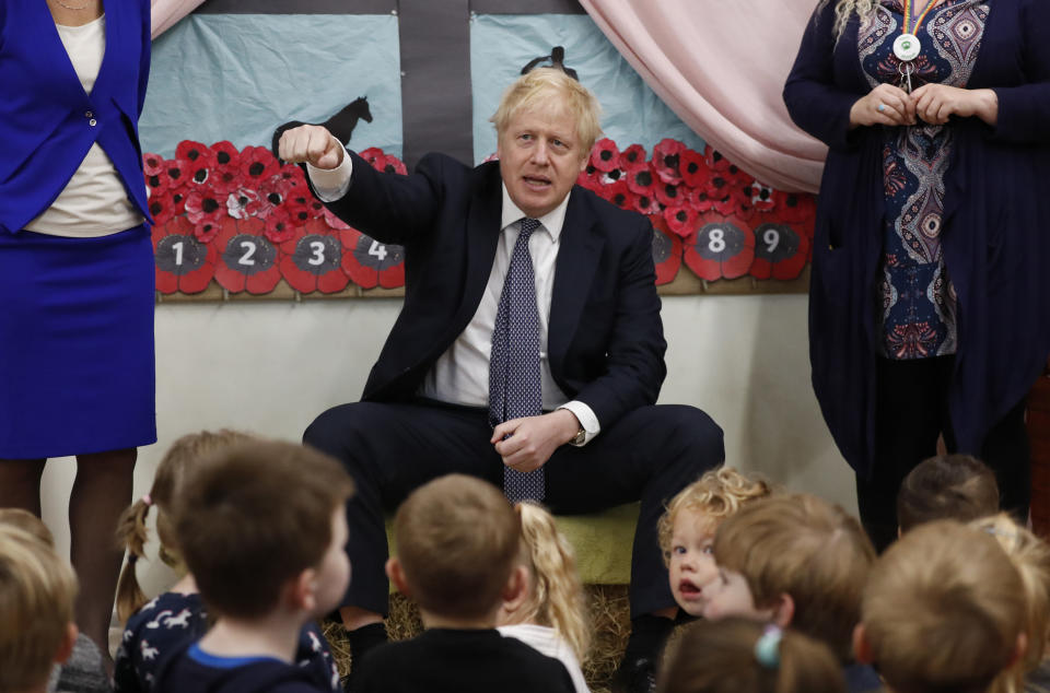 Britain's Prime Minister Boris Johnson visits the West Monkton CEVC Primary School on a General Election campaign trail in Taunton, England, Thursday, Nov. 14, 2019. Britain goes to the polls on Dec. 12. (AP Photo/Frank Augstein, Pool)