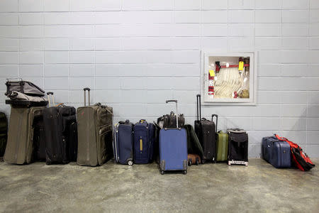 Bags that have been donated for Caribbean refugees, whose homes were destroyed by Hurricane Irma, are seen at a convention centre in San Juan, Puerto Rico September 14, 2017. REUTERS/Alvin Baez