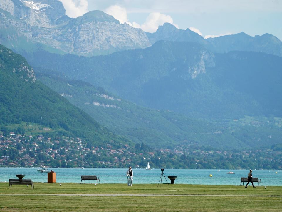 Forensics officers at the scene in Annecy (AP)