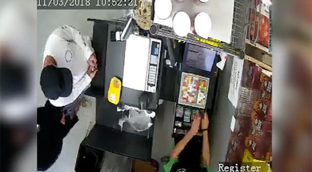 The man handed the cashier coins in an apparent ploy to her. Source: Supplied