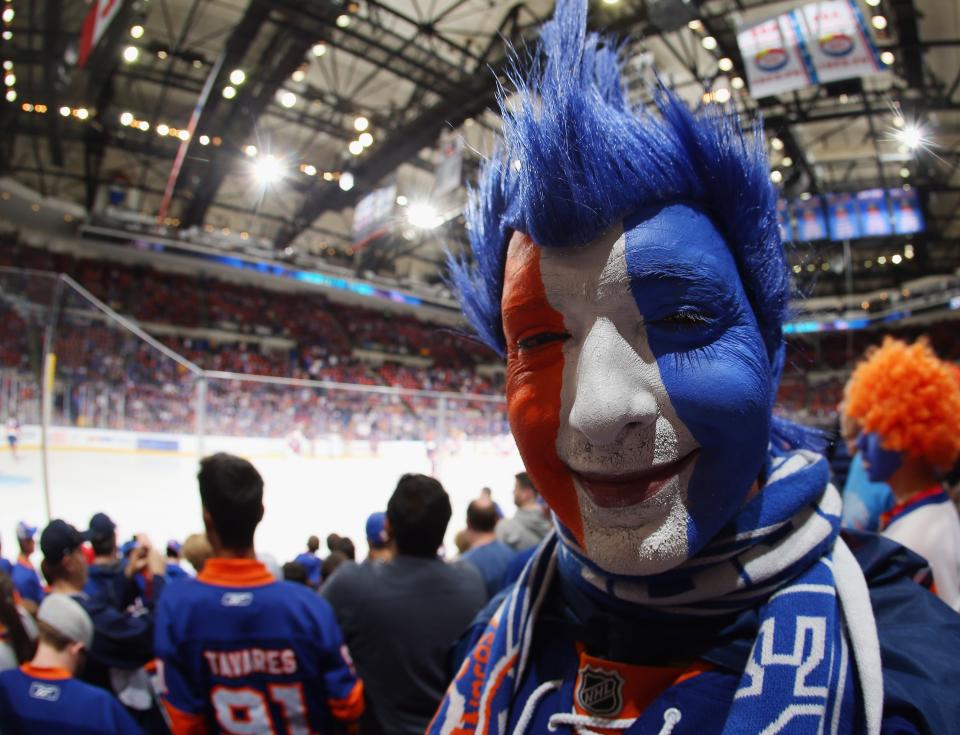 UNIONDALE, NY - APRIL 25: New York Islanders fans prepare for could be the final game in this building against the Washington Capitals in Game Six of the Eastern Conference Quarterfinals during the 2015 NHL Stanley Cup Playoffs at the Nassau Veterans Memorial Coliseum on April 25, 2015 in Uniondale, New York. (Photo by Bruce Bennett/Getty Images)