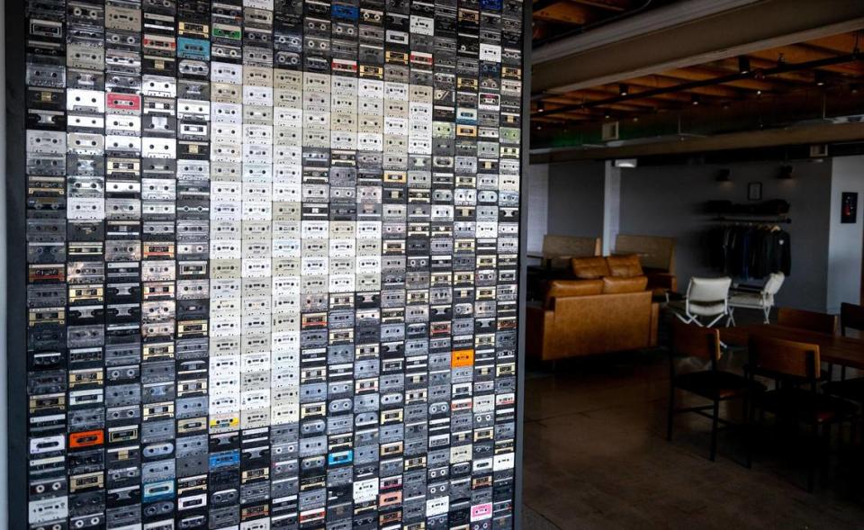 A wall of cassette tapes forms an F at Friction Beer Co.
