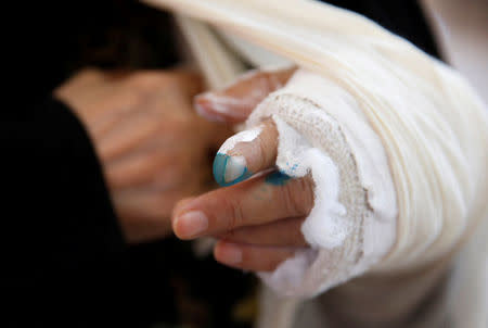 The ink-stained finger of a Jordanian woman seen after casting her ballot at a polling station for local and municipal elections in Amman, Jordan, August 15, 2017. REUTERS/Muhammad Hamed