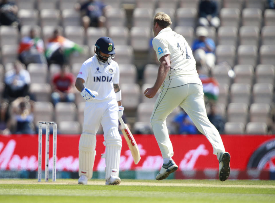 New Zealand's Kyle Jamieson, right, celebrates the dismissal of India's captain Virat Kohli, left, during the sixth day of the World Test Championship final cricket match between New Zealand and India, at the Rose Bowl in Southampton, England, Wednesday, June 23, 2021. (AP Photo/Ian Walton)