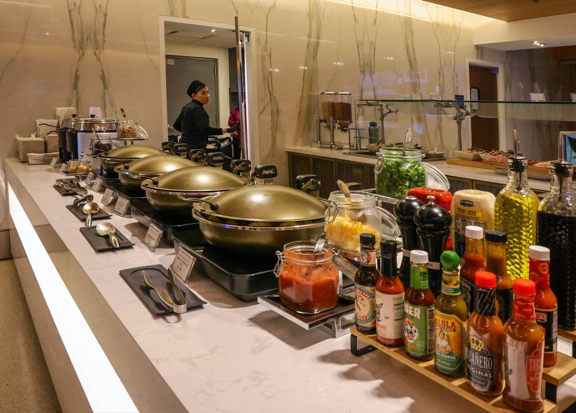 You can pour on the sauce at the buffet at the new Delta Sky Club.