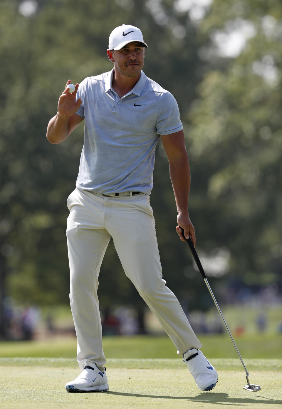 Brooks Koepka reacts after making a birdie on the eighth hole during the third round of the PGA Championship golf tournament at Bellerive Country Club, Saturday, Aug. 11, 2018, in St. Louis. (AP Photo/Jeff Roberson)